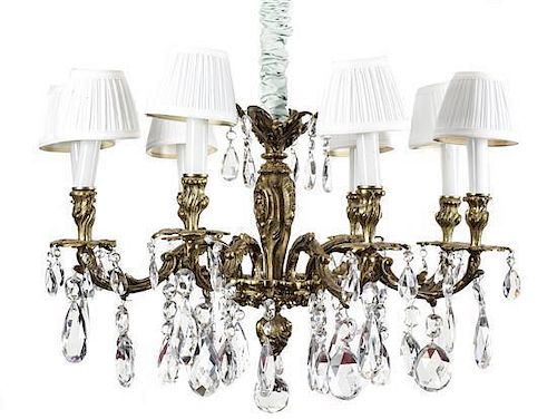 A Louis XV Style Bronze and Crystal Eight-Light Chandelier, Diameter 31 inches.