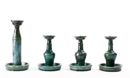 Four Green-Glazed Art Pottery Candlesticks, Height 10 3/4 inches.