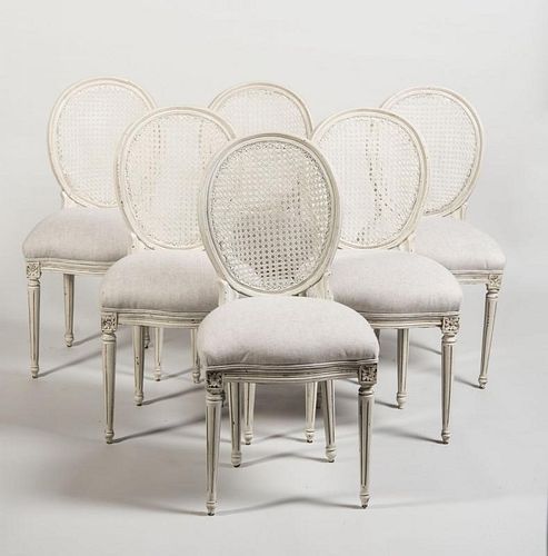 SET OF SIX LOUIS XVI STYLE PAINTED AND CANED CHAISES