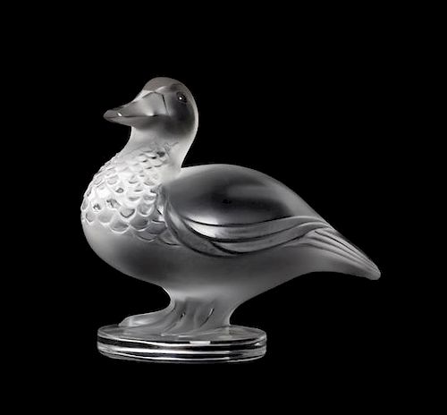 * A Lalique Molded and Frosted Glass Figure Width 5 1/2 inches.