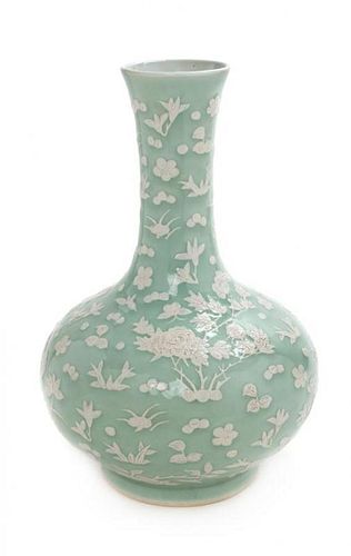 A Slip-Decorated Celadon Ground Porcelain Vase Height 17 inches.