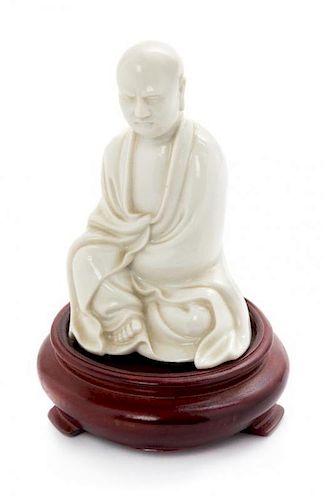 * A Blanc-de-Chine Porcelain Figure of a Luohan Height 4 inches.