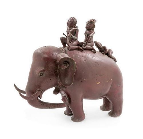 * An Indian Bronze Figural Group of Elephant and Riders Height 14 inches.