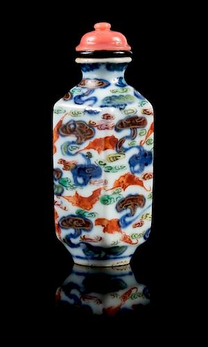An Underglaze Blue and Enamelled Porcelain Snuff Bottle Height 2 7/8 inches.