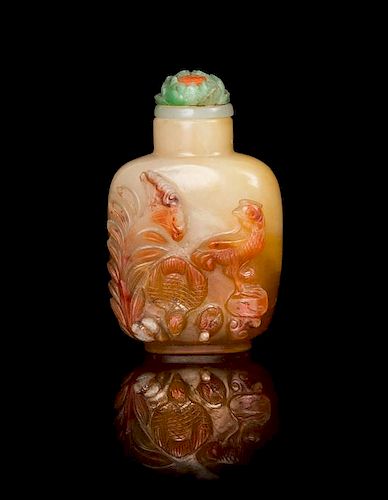 * A Carved Agate Snuff Bottle Height 2 1/2 inches.