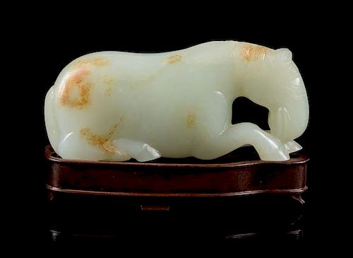 * A Carved White Jade Figure of a Horse Length 3 3/4 inches.