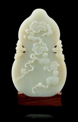 * A Celadon Jade Gourd-Form Plaque Height 4 7/8 inches.