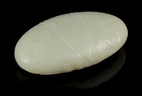 * A Pale Celadon Jade Pebble Length 3 3/4 inches.