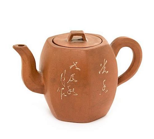 A Yixing Pottery Teapot Height 3 3/4 inches.