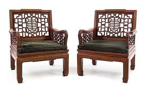A Pair of Chinese Rosewood Armchairs Height 34 x length 26 1/2 x depth 24 3/4 inches.