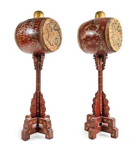 * A Pair of Chinese Parchel Gilt and Red Lacquered Wood Drums on Stands Height 73 inches.