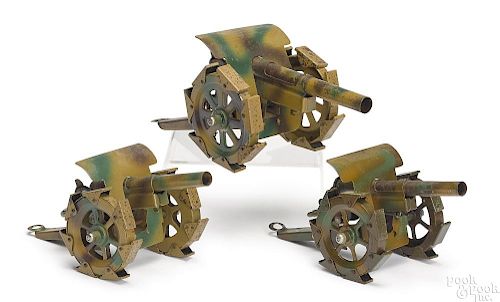 Three German camouflage painted tin field guns
