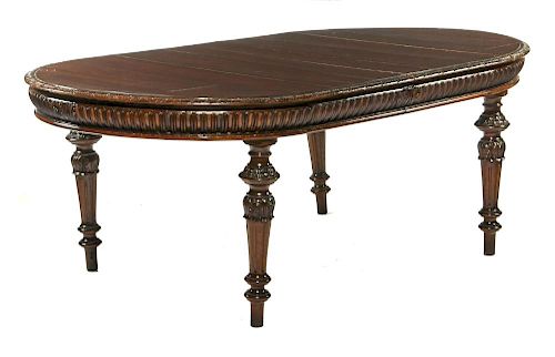 Carved mahogany dining table