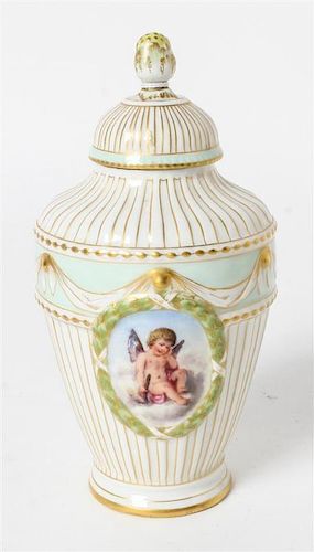 A KPM Parcel Gilt and Painted Porcelain Tea Caddy Height 6 1/2 inches overall.