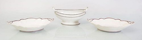 WEDGWOOD CREAMWARE TWO-HANDLED FRUIT COMPOTE AND A PAIR OF CREAMWARE NAVETTE-FORM DISHES