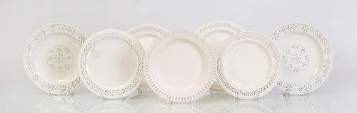 SEVEN ENGLISH GLAZED POTTERY PLATES WITH RETICULATED BORDERS