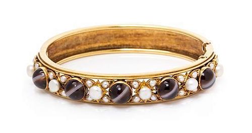 A Victorian Banded Agate, Pearl and Seed Pearl Bangle Bracelet, 16.50 dwts.
