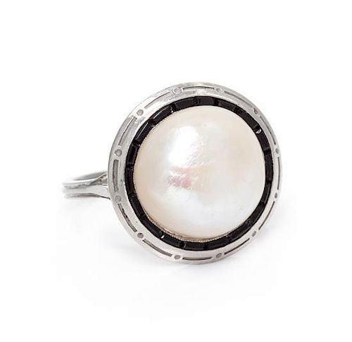 An Antique Platinum, Natural Pearl and Onyx Ring, 4.10 dwts.