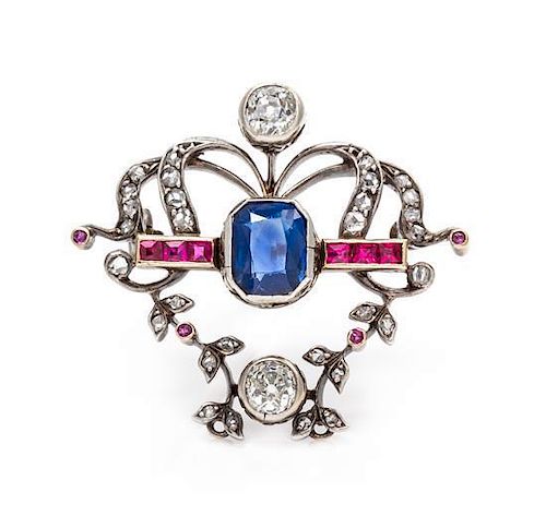 * A Victorian Silver Topped Gold, Diamond, Sapphire, and Synthetic Ruby Pendant/Brooch, 4.80 dwts.