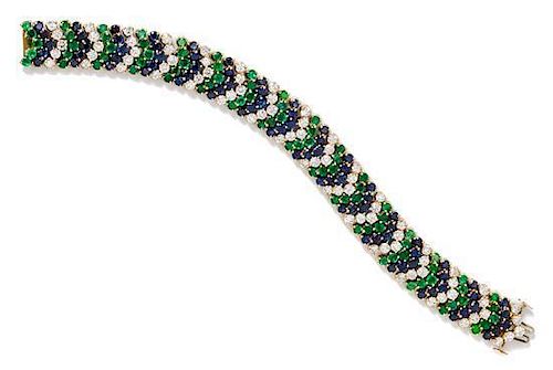 * An 18 Karat Yellow Gold, Diamond, Sapphire, and Emerald Bracelet, Hammerman Brothers, 34.70 dwts.