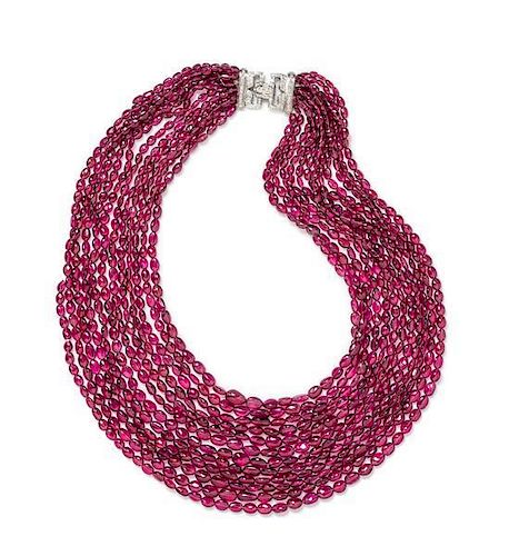 An 18 Karat White Gold, Diamond and Graduated Multistrand Pink Tourmaline Bead Necklace, 163.90 dwts.