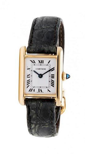 * An 18 Karat Yellow Gold 'Tank' Wristwatch, Cartier,