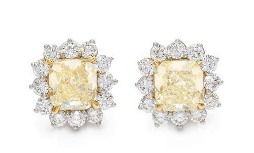A Pair of Platinum, Yellow Gold, Fancy Yellow Diamond and Diamond Earclips, 6.10 dwts.