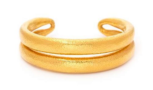 * A 22 Karat Yellow Gold Cuff Bracelet, 67.80 dwts.