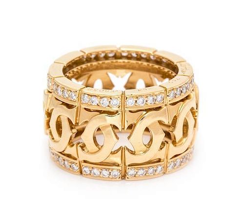 An 18 Karat Yellow Gold and Diamond 'Double C' Ring, Cartier, 9.50 dwts.