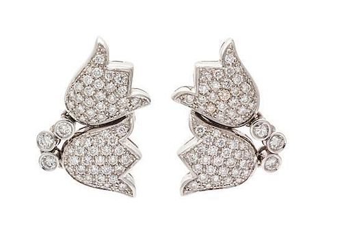 * A Pair of 18 Karat White Gold and Diamond Double Tulip Motif Earclips, 11.60 dwts.