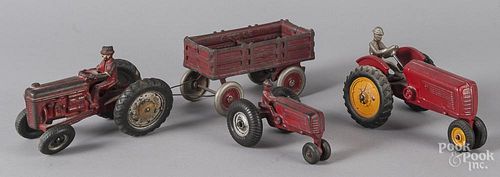 Three Arcade cast iron tractors