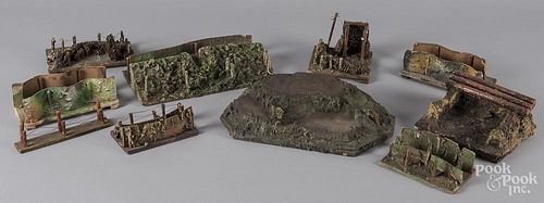 Painted composition and wood bunkers and trenches