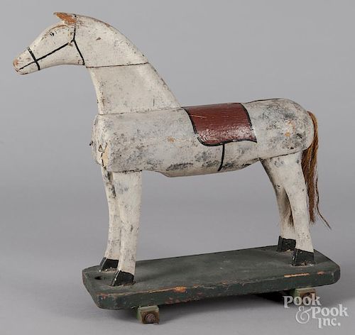 Primitive painted wood horse pull toy