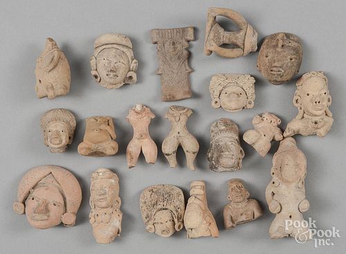 Group of pre-Columbian style pottery relics.