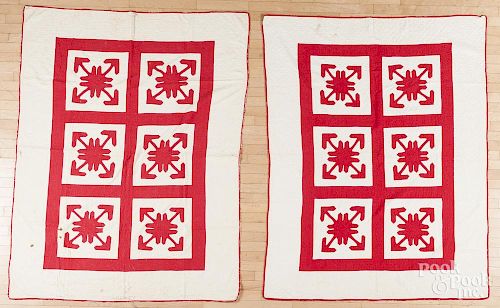 Pair of red and white appliqué quilts