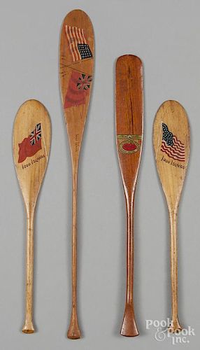 Four miniature souvenir paddles