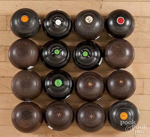 Sixteen English lawn bowling balls.