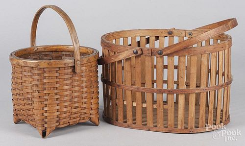 Two woven baskets with swing handles