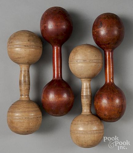 Two pairs of wooden dumbbells.