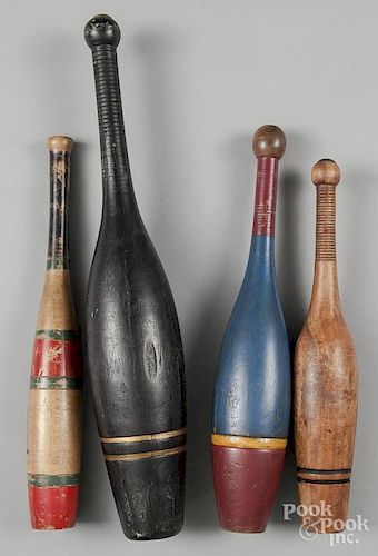 Four painted Indian clubs