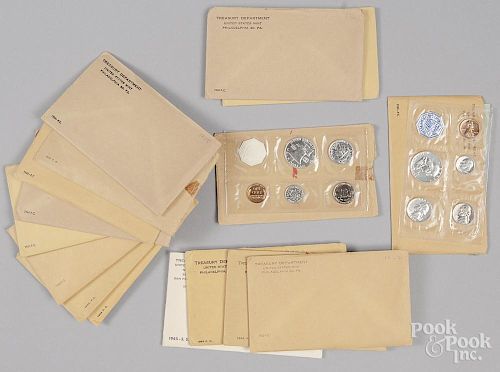 Sixteen U.S. Mint sets, 1957-64.