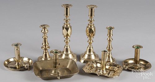 Eight assorted brass candlesticks