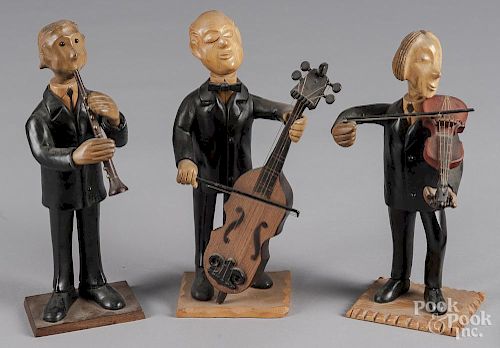 Three carved and painted musicians