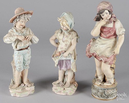 Three bisque figures of children