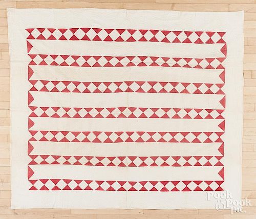 Red and white strip quilt