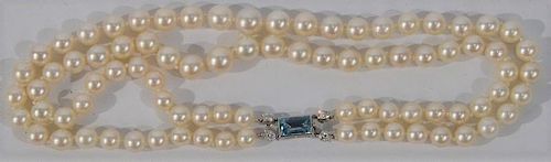 NO CREDIT CARDS FOR JEWELRY  Cartier pearl double strand necklace with 18 karat white gold clasp, signed Cartier and mounted
