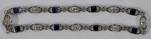NO CREDIT CARDS FOR JEWELRY  Platinum bracelet set with diamonds and blue sapphires.  length 7 inches  10 grams  Credit card.
