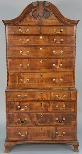 Chippendale maple chest on chest having closed bonnet top in two parts, upper portion with two drawers over four drawers flan