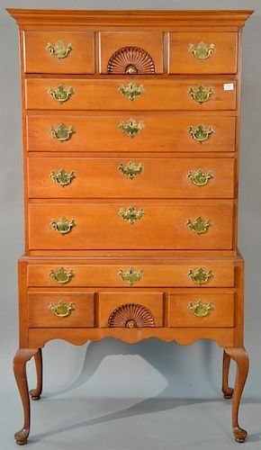 Chapin School Queen Anne cherry high chest in two parts, upper portion with cornice molded top over center fan carved drawer