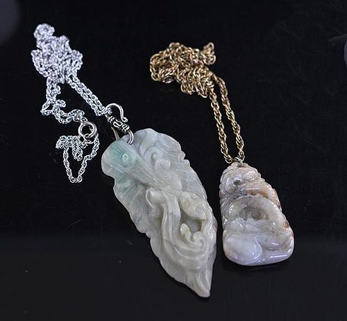 Two carved Chinese jade pendants on chains